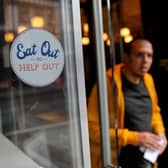 The Government's Eat Out to Help Out scheme was one measure taken during the survey period to aid the economy. (Photo by Tolga AKMEN / AFP) (Photo by TOLGA AKMEN/AFP via Getty Images)