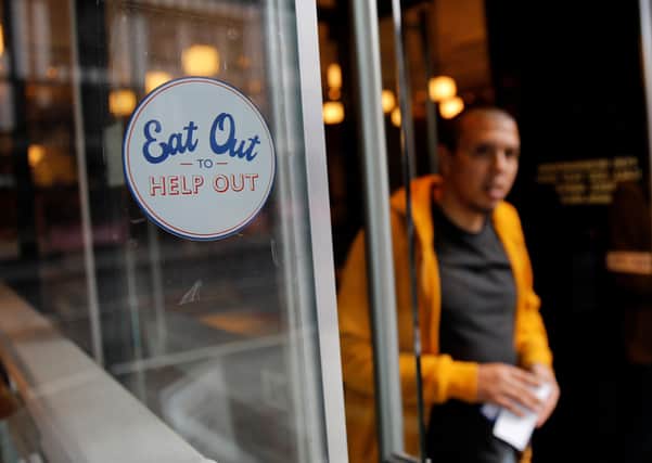 The Government's Eat Out to Help Out scheme was one measure taken during the survey period to aid the economy. (Photo by Tolga AKMEN / AFP) (Photo by TOLGA AKMEN/AFP via Getty Images)