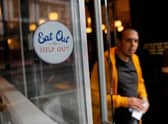 The Government's Eat Out to Help Out scheme was one measure taken during the survey period to aid the economy. (Photo by Tolga AKMEN / AFP) (Photo by TOLGA AKMEN/AFP via Getty Images)