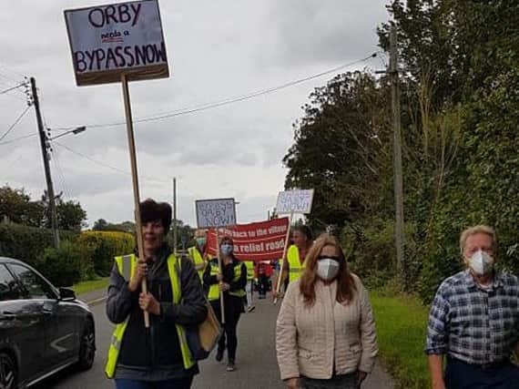 Protestors in Orby calling for a bypass to free them of holiday traffic.