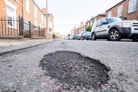 Potholes in Queen Street. Picture: John Aron.
