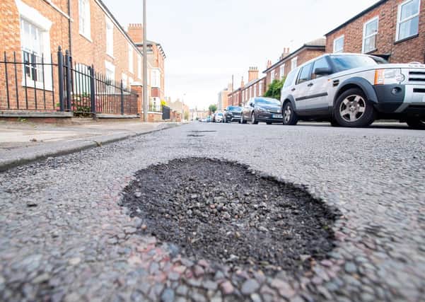 Potholes in Queen Street. Picture: John Aron.