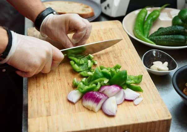 Preparing food in a restaurant kitchen (stock image)