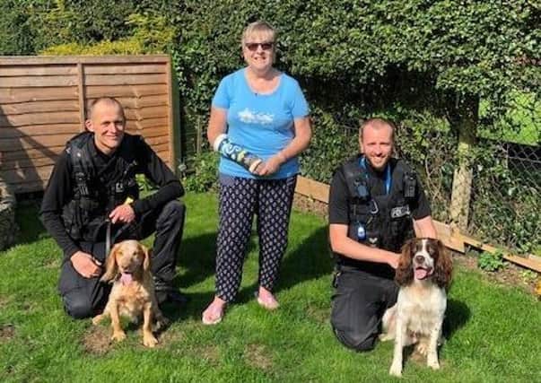 Barbara with the two police officers and their dogs.