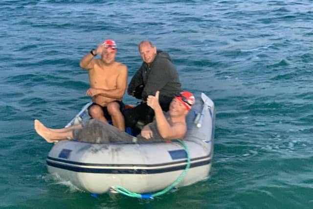 He's done it! Capt Harry Grantham heads back to his support boat after swimming the English Channel. EMN-201109-092744001