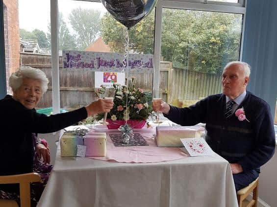 Kenneth and Renee White enjoying a champagne breakfast.