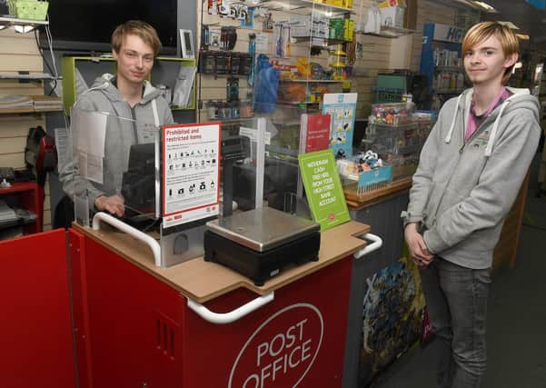 Pop-up Post Office at Pop-In Bargains. L-R Lee Taylor - post master, Corey Odam - post office assistant. EMN-200914-094006001