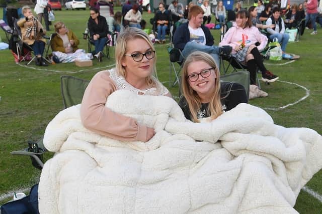 Open air cinema on Boston's Central Park. L-R Victoria Payne and Emilia Payne 12 of Boston. EMN-200914-135427005