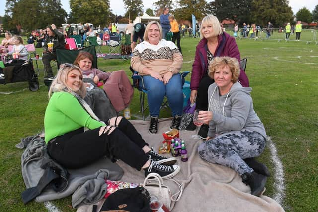 Open air cinema on Boston's Central Park. L-R Rosey Langford, Millie Allen 6, Andrea Allen, Alex Allen, Laura Langford. EMN-200914-135345005