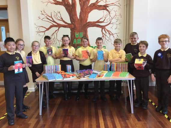 Miss Abi Johnson and Miss Emma Green took this photo of their Year 6 pupils receiving the gift for all the pupils.