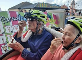 Freda Silvester and Dot Power of Syne Hills Care Home enjoying a treat on the Cycling Without Age trishaw near the Vintage Fair in Skegness.