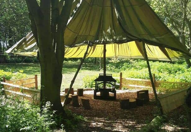 The parachute shelter provides airy space for socially distanced activities.