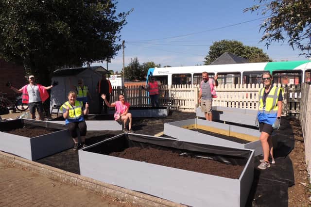 The community rail volunteers working on the station allotment at Sleaford. EMN-200915-181342001