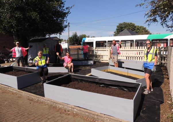 The community rail volunteers working on the station allotment at Sleaford. EMN-200915-181342001