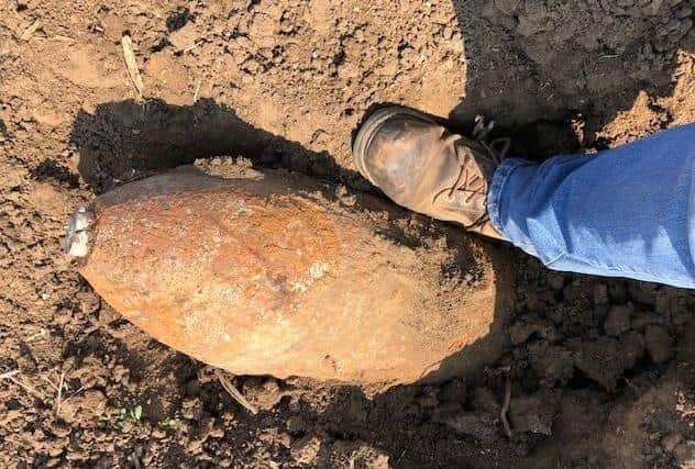 The unexploded shell dug up in Harmston prior to police cordoning off the area and a bomb disposal crew carrying out a controlled explosion to make it safe. EMN-200916-083402001