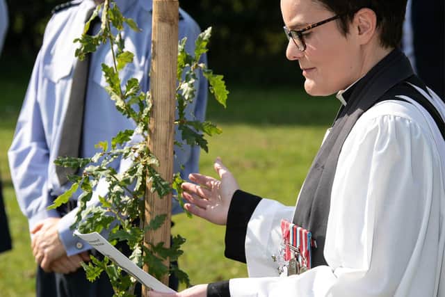 Padre Hake blesses the tree. Image Sgt Paul Oldfield