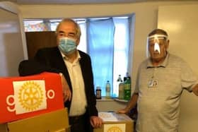 Rotary's Geoff Day (left) and Bob Taylor from the food bank.