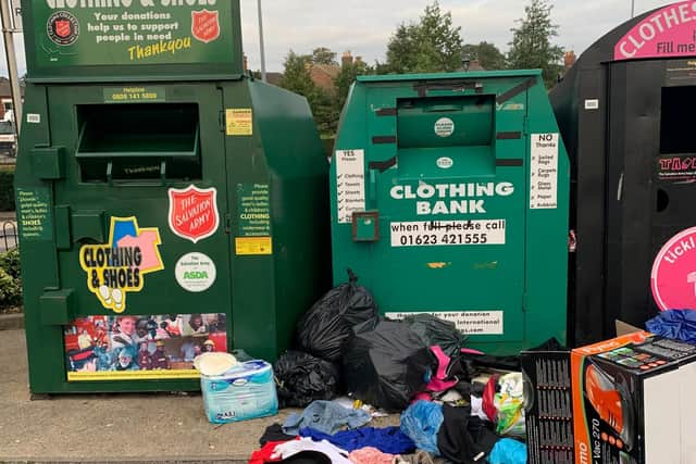 Rubbish dumped by a recycling bin