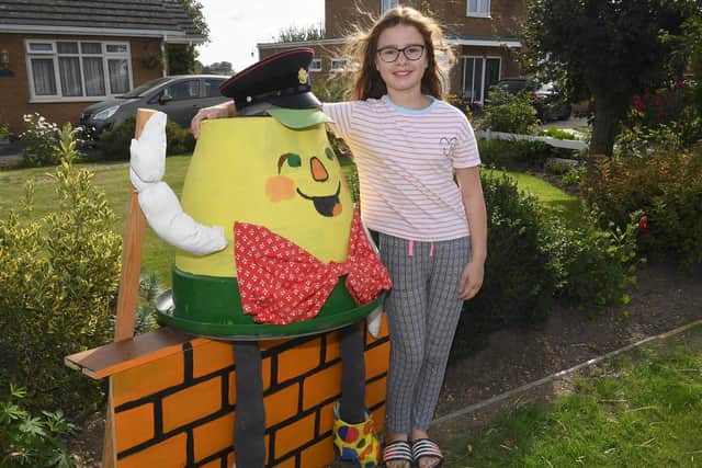 North Kyme scarecrow festival. Lily Midgley 9 with the scarecrow she made at her Grandpa's house. EMN-200914-094112001