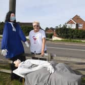 North Kyme scarecrow festival. Valarie Thomas looking at a scarecrow, made by her neighbour Sheila Palmer. EMN-200914-094101001