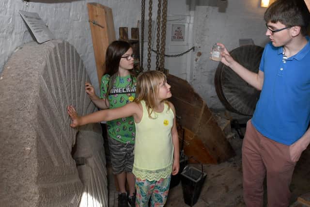 Heckington Windmill. L-R Keldan Brooks 9 and Freyja Brooks 7 with windmill tour guide Tom Wood (Duke of Edinburgh volunteer) EMN-200914-094134001