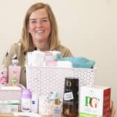 EDAN fundraiser Lucy with one of the packs or pamper hampers
funded by Lincolnshire Freemasons for domestic abuse victims. EMN-200921-133449001