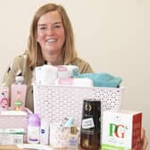 EDAN fundraiser Lucy with one of the packs or pamper hampersfunded by Lincolnshire Freemasons for domestic abuse victims. EMN-200921-133449001