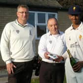 Pothula collects his Man of the Match champagne from umpires Nick Law and Paul Goodhand.