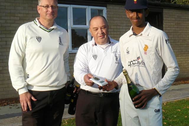 Pothula collects his Man of the Match champagne from umpires Nick Law and Paul Goodhand.