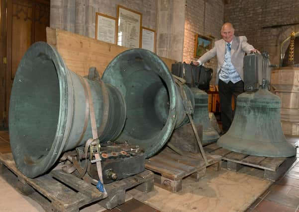 Ruskington church being taken away for repair. Alwyn Kirk with the bells. EMN-200921-170122001