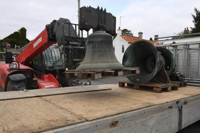 Ruskington church being taken away for repair. Bells being loaded onto the lorry by Tom Allen. EMN-200921-170036001