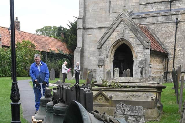 Ruskington church being taken away for repair. Graham Clifton, bell hanger for White's of Appleton. EMN-200921-170003001