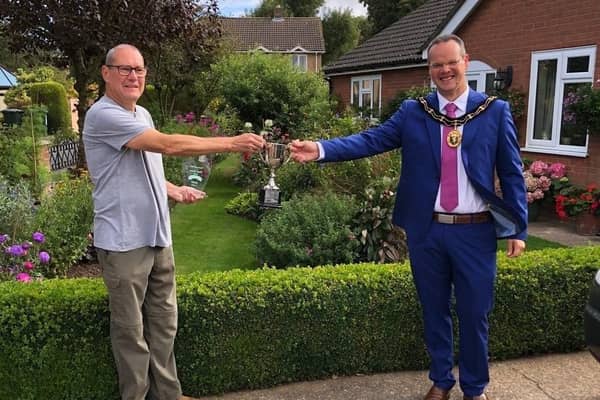 Harry Kerman receives his award from the Mayor of Louth, Councillor Darren Hobson.