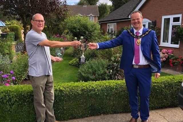 Harry Kerman receives his award from the Mayor of Louth, Councillor Darren Hobson.