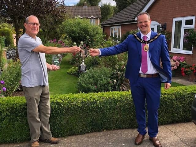 Harry Kerman receives his award from the Mayor of Louth, Councillor Darren Hobson.