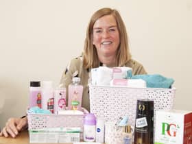 EDAN fundraiser Lucy with one of the packs or ‘pamper hampers’