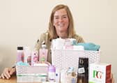 EDAN fundraiser Lucy with one of the packs or ‘pamper hampers’