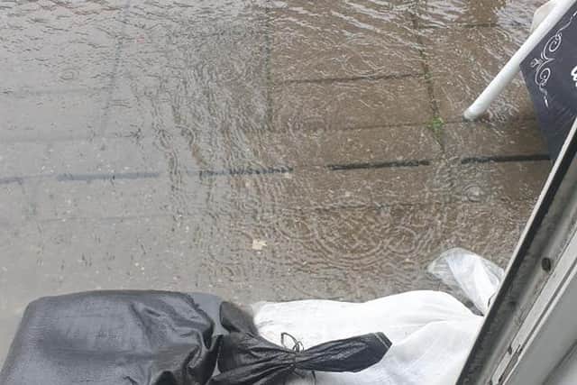 Sandbags outside a shop in Roman Bank, Skegness, during the rain. Photo: Barry Robinson.
