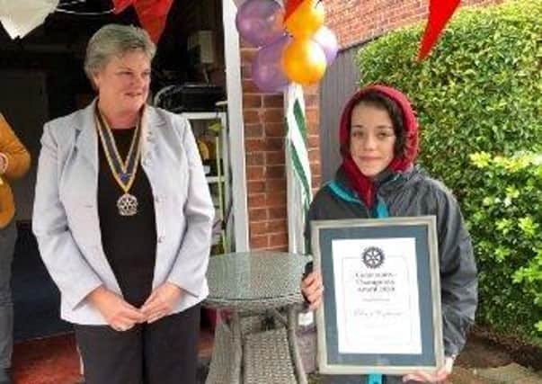 Eloise holds her award, alongside Rotary Club of Louth branch president Pam Ashley-Marsh.