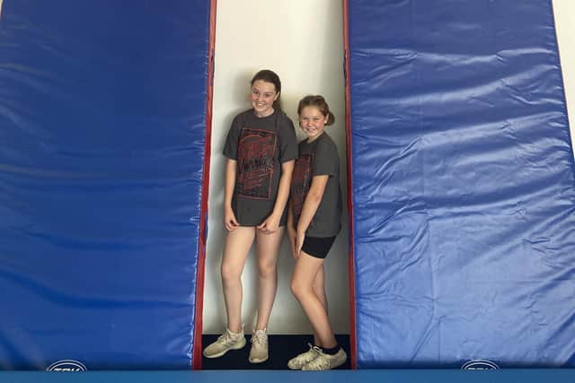 Lily Blades and Melissa Hull, of East Coast Warriors, with the new crash mats.