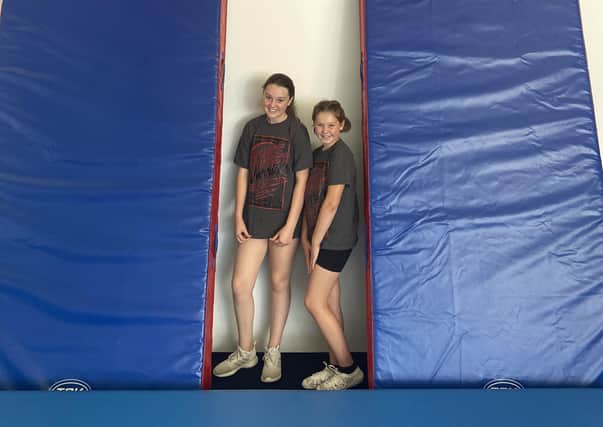 Lily Blades and Melissa Hull, of East Coast Warriors, with the new crash mats.