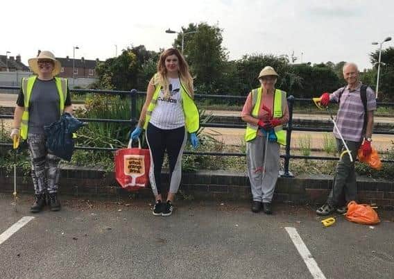 Litter picking volunteers on Station Road for Bin the Butts Week. EMN-200929-163004001