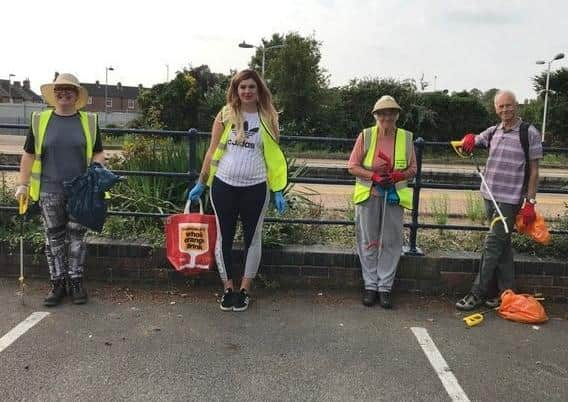 Litter picking volunteers on Station Road for Bin the Butts Week. EMN-200929-163004001