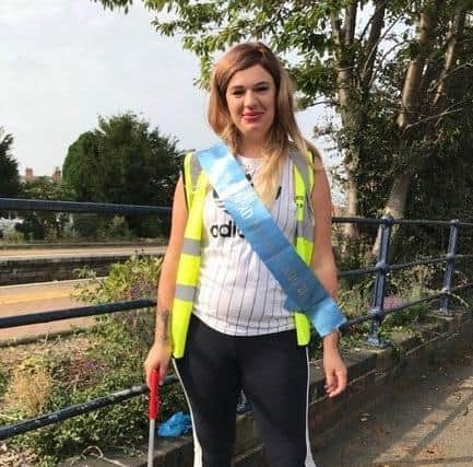 Sleaford's Miss Atlantic contestant Hannah Brennan, picking up cigarette litter around Sleaford station. EMN-200929-163014001