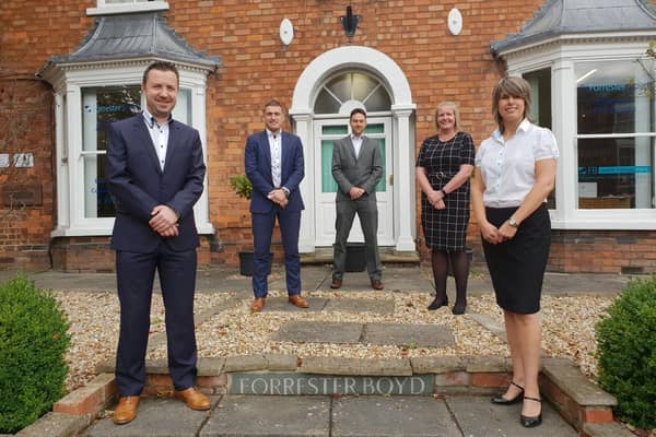 Lee Bradbury with partners Adam Millson, Phil George, Toni Beecroft and Nicola Hunt outside the Louth office.