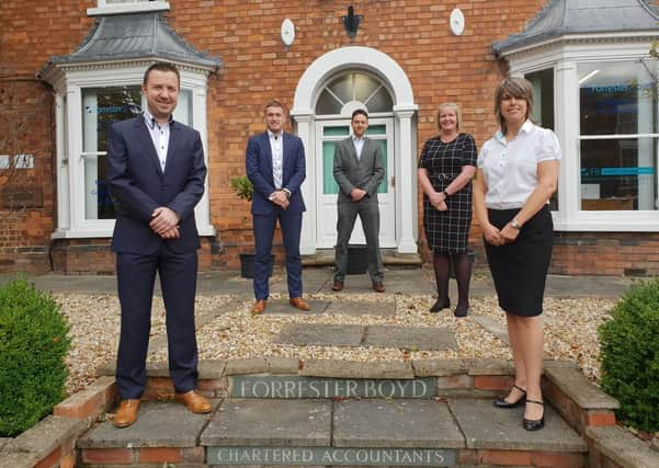 Lee Bradbury with partners Adam Millson, Phil George, Toni Beecroft and Nicola Hunt outside the Louth office.