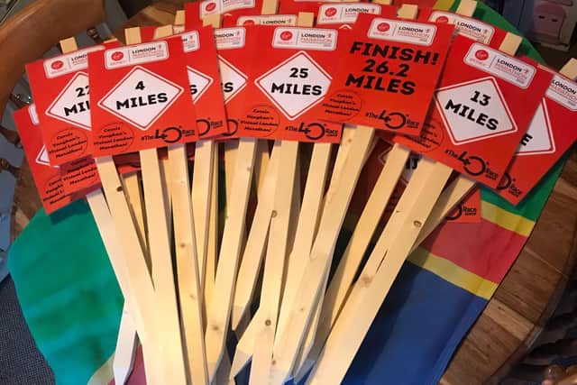 The mile markers made by Carrie Vaughan's dad to help her along her route.