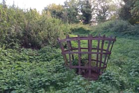 The basket from an old beacon used for an historic event amid the dumping ground at the corner of Sleaford Cemetery which is set to be transformed. EMN-200510-155701001