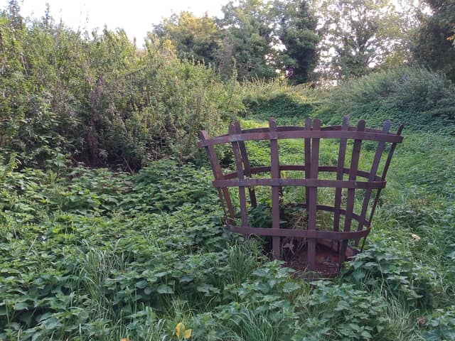 The basket from an old beacon used for an historic event amid the dumping ground at the corner of Sleaford Cemetery which is set to be transformed. EMN-200510-155701001