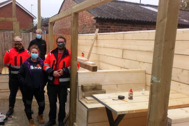 Claire Farrell (centre) with some of the tradesmen involved in the project.